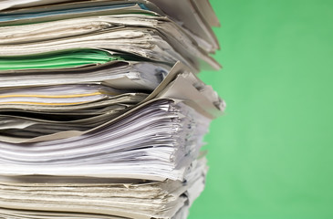 Finance documents on green background