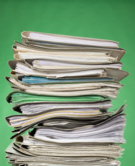 Finance documents on green background