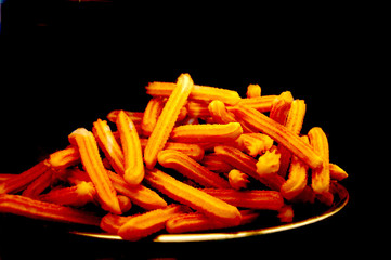 Churros isolated on black