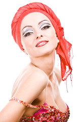smiling woman with professional make-up and red turban