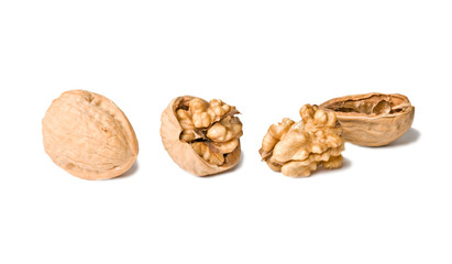 Cracked walnuts isolated on white background
