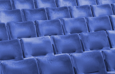 Rows of blue seats at an modern university auditorium