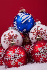 Christmas balls over a red background