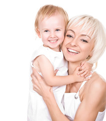 cute daughter embracing her happy mother