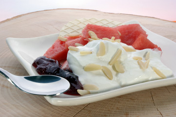 melon with cream fresh and almond slivers and wafer