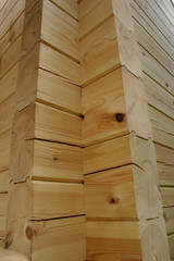 Corner of planed pine log house