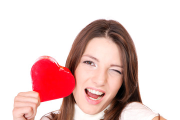 Young woman holding a red heart