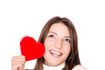 Young woman holding a red heart