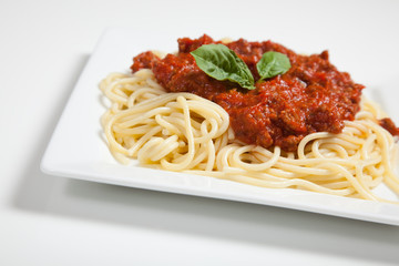 Plate of spaghetti on white
