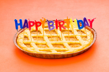 Happy birthday candles in the pie
