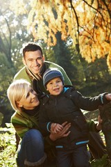 Happy family outdoor at autumn