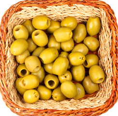 Small straw basket full of olives isolated on white