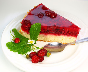 Raspberry cake with raspberries and leaves isolated on white