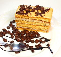 Coffee cake with coffee beans and chocolate isolated on white