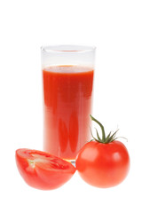 Ripe red tomatoes and glass of tomato juice.
