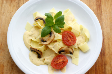 home made tagliatelle with grilled tomato and sauce