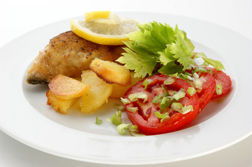 carp steak with potato and organic tomato
