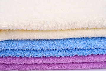 Fototapeta na wymiar Stack of colorful towels on white