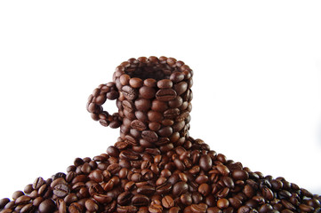 Cup from coffee grains on a white background