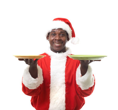 happy black santa claus holding two plates