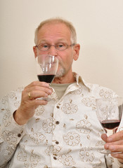 Senior man tasting wines