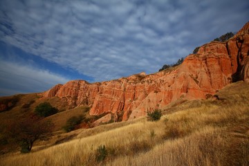 Red rocks in canyon and blue sky at sunrise