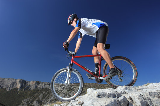 A man riding a mountain bike downhill style © Ljupco Smokovski