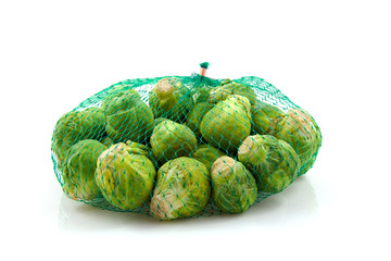 Net Brussels sprouts over white background