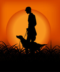 hunter with dog in the sunset