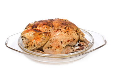 Roast chicken in glass plate isolated on white