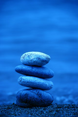 background image of the beach with Pile of pebble Stones