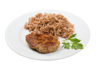 chops with buckwheat on plate.