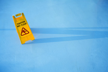 close up shot of a yellow caution on floor