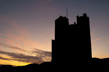 sunset silhouette of orford castle in the uk