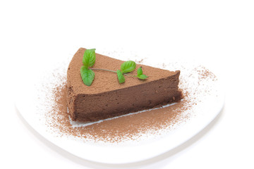 Chocolate cheesecake decorated with mint sprig