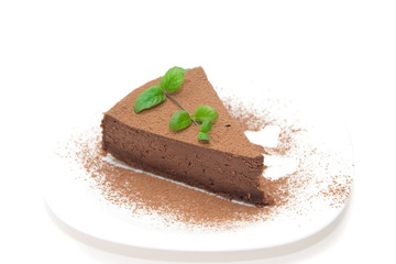 Chocolate cheesecake decorated with mint sprig