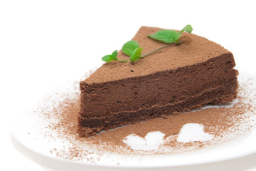 Chocolate cheesecake decorated with mint sprig