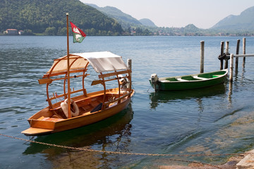 Naklejka na ściany i meble Wooden boats on Maggore lake, Ticino, Switzerland.