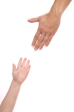 Woman reaching for childs hand