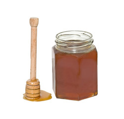 Honey and honey dipper (honey stick) isolated on white backgroun
