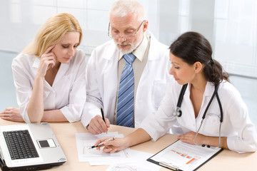 Fototapeta premium Professor and two physicians