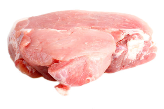Piece of crude meat. It is isolated. White background.