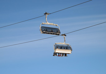 Ski chair-lift with skiers