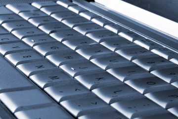 Fototapeta premium Laptop keyboard blue