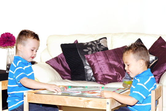 children playing board game