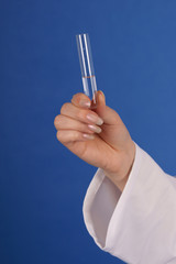 Hand with test tube