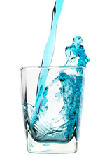 Splash, blue drink is being poured into glass © Serhiy Kobyakov