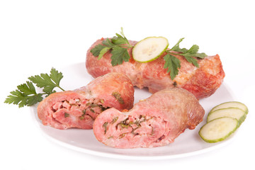 Cutlet on plate with parsley and cucumber