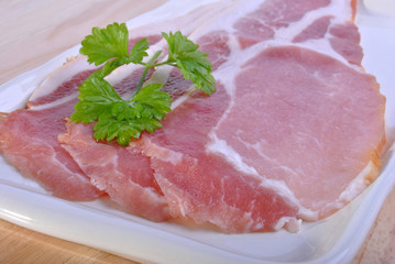 smoked bacon on a plate with organic parsley