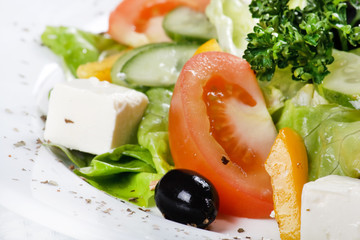 Caesar salad in a white plate.